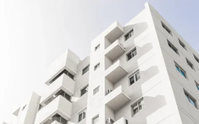 low-angle-shot-facade-white-modern-building-blue-clear-sky-1024x681